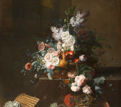 Still life with basket of flowers and box of ribbons